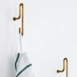 MOEBE 2 Ganchos de pared small, oro mate Color dorado